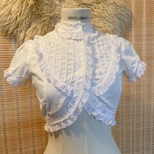 high neck ruffled blouse with accent crop